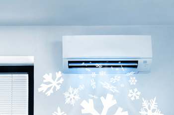 a white wall with snowflake stencils and a air conditioner on it